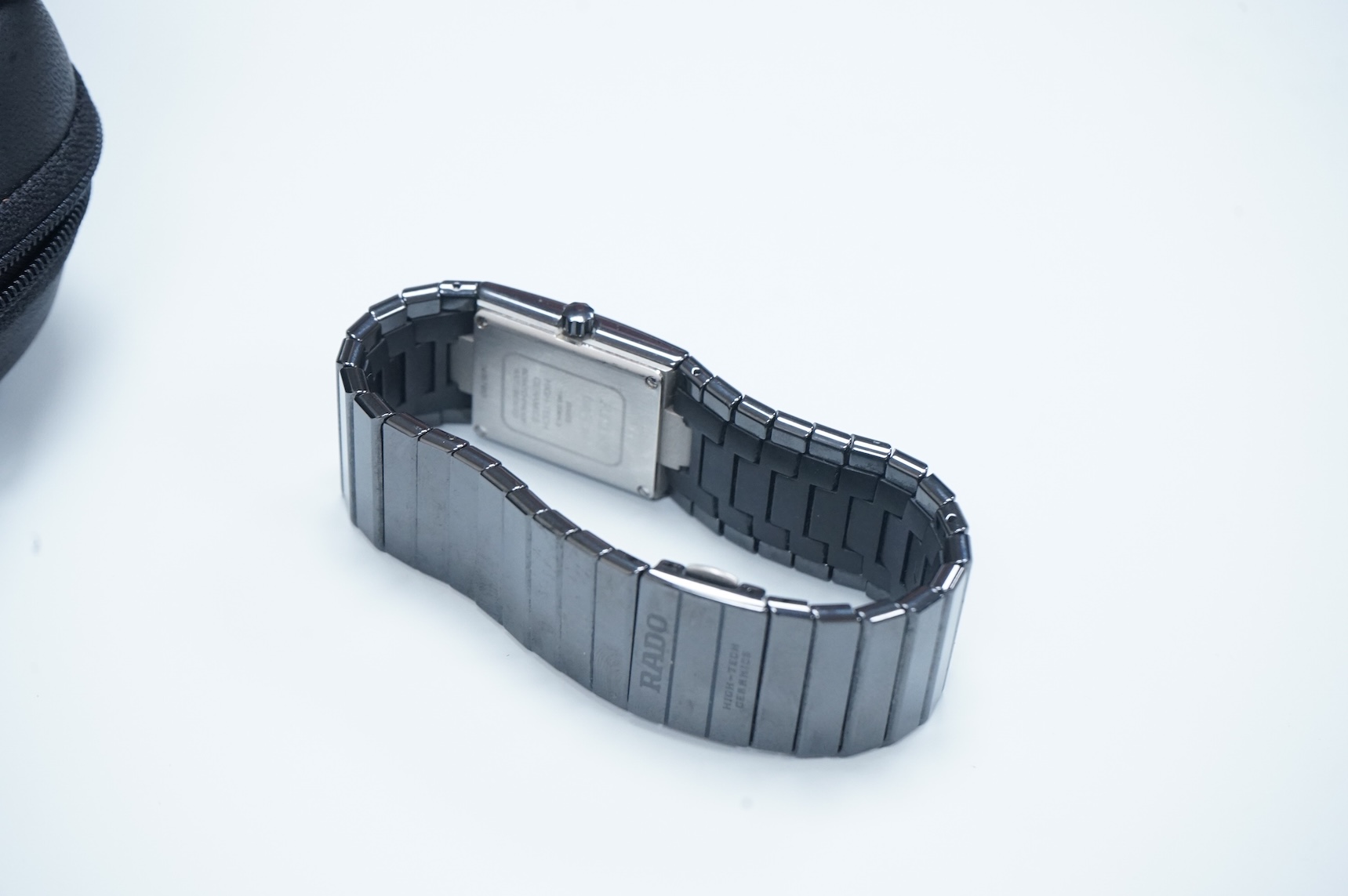 A modern Swiss titanium and ceramic Rado Diastar quartz wrist watch, with rectangular dial and dot markers, case diameter 25mm, with Rado box and booklet.